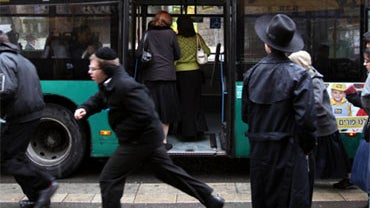 Israeli ultra-Orthodox Jewish women board a bus from the back door in Jerusalem on February 3, 2010. A group of Jewish women are trying through the Supreme Court to end the segregation of sexes on a number of bus lines serving Orthodox Jews that relegate  