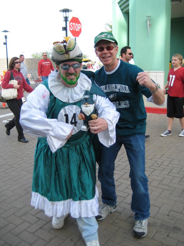 Jim Kmetzo with a green bearded fan outside arena 