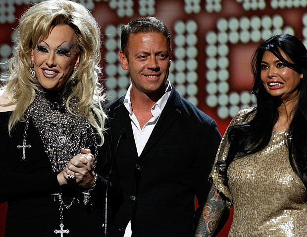 LAS VEGAS, NV - JANUARY 08: (L-R) Adult film actors Chi Chi LaRue, Rocco Siffredi and Tera Patrick present an award at the 28th annual Adult Video News Awards Show at The Pearl concert theater at the Palms Casino Resort January 8, 2011 in Las Vegas, Nevad 