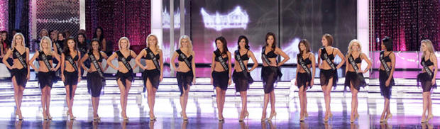 The first 15 finalists stand on stage after walking in the swim suit competition during the 2011 Miss America pageant. 