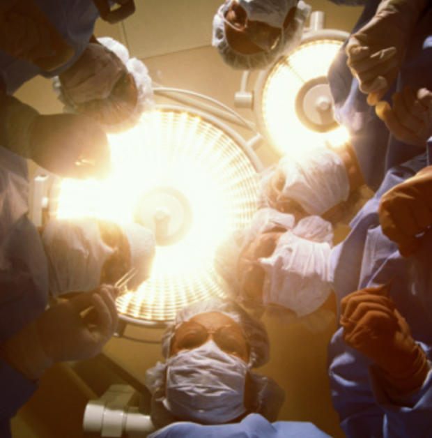 Doctors, nurses over patient in surgery 