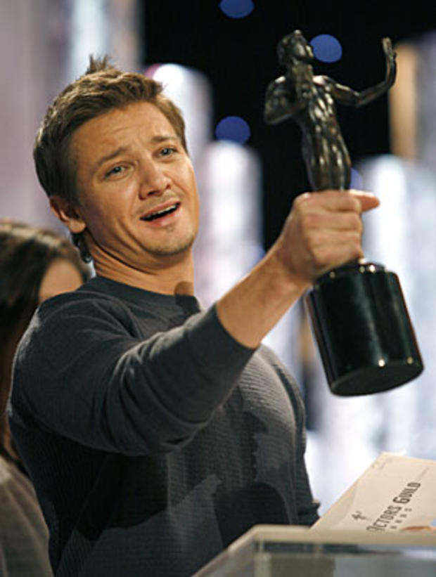 Actor Jeremy Renner holds up a SAG Awards statuette during rehearsal for the SAG Awards at the Shrine Auditorium in Los Angeles on Saturday, Jan. 29, 2011. Renner is one of the award presenters. (AP Photo/Jason Redmond 
