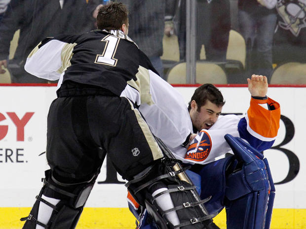 Pittsburgh Penguins goalie Brent Johnson (1) knocks New York Islanders goalie Rick DiPietro 