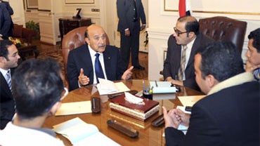 Egyptian Vice President Omar Suleiman, center, meets with representatives of protesters of 25th January movement in Cairo, Egypt, Sunday, Feb. 6, 2011.  