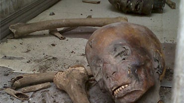 In this photo taken early Saturday, Jan. 29, 2011, parts of unidentified mummies are seen damaged on the floor of the Egyptian Museum in Cairo, Egypt. 