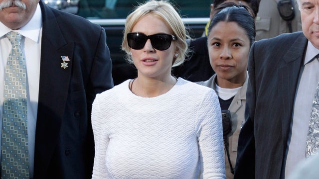 ctress Lindsay Lohan, center, arrives at the LAX Airport Courthouse in Los Angeles 