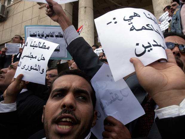 lawyers in black robes shout anti-Mubarak slogans 