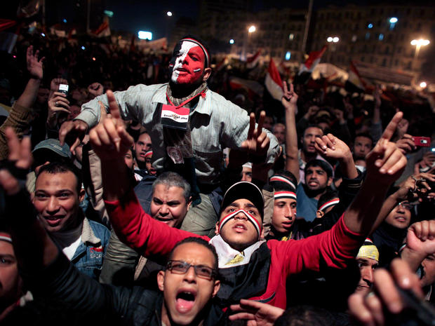 Egyptians celebrate the news of the resignation of President Mubarak 