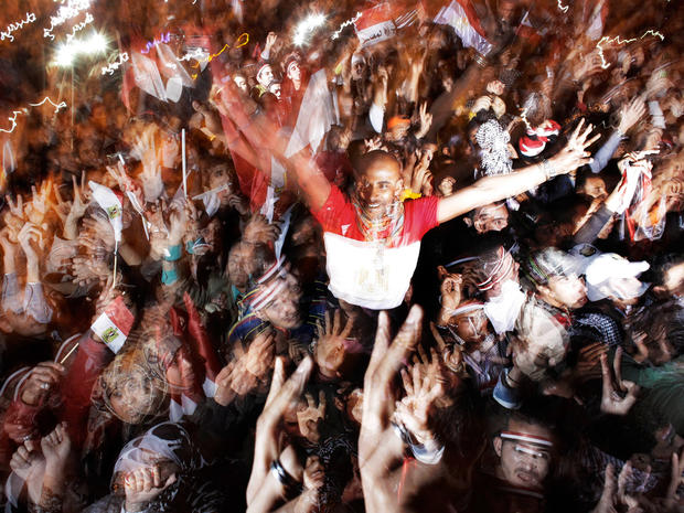 Egyptians celebrate the news of the resignation of President Hosni Mubarak 