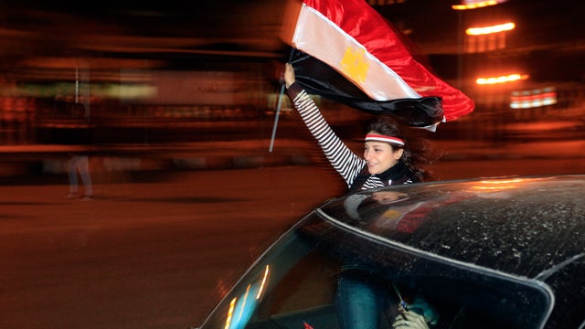 An Egyptian woman celebrates after President Hosni Mubarak resigned  