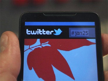 In this photo illustration a smartphone displays a page from Twitter on January 27, 2011 in Cairo, Egypt. 