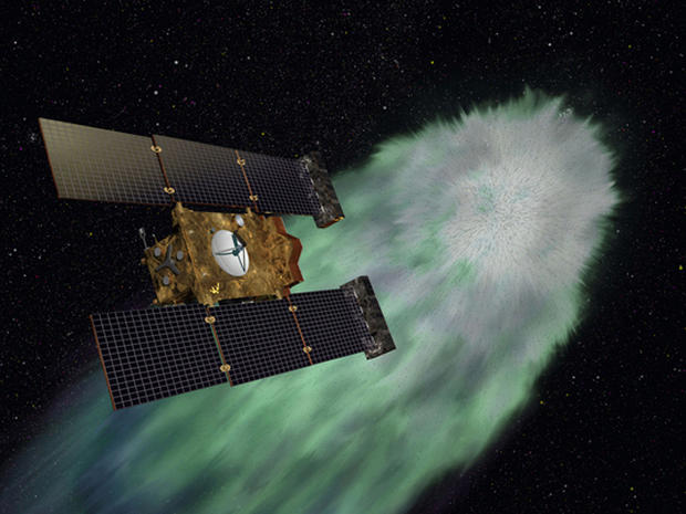 Artist illustration of NASA's Stardust-NExT spacecraft  approaching comet Tempel1 