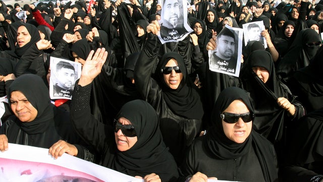 Bahraini protesters shout slogans 