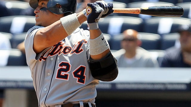 Miguel Cabrera follows through on a home run 