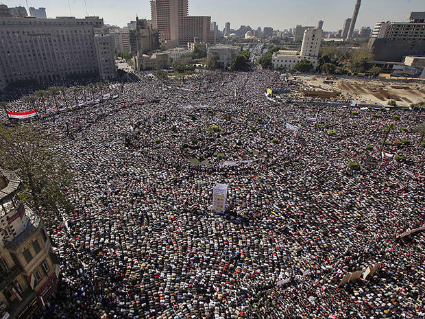 Tens of thousands of Egyptians pray and celebrate the fall of the regime of former President Hosni Mubarak 