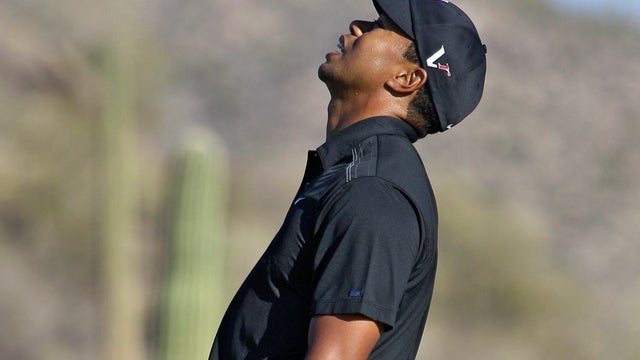 Tiger Woods reacts after missing a putt 