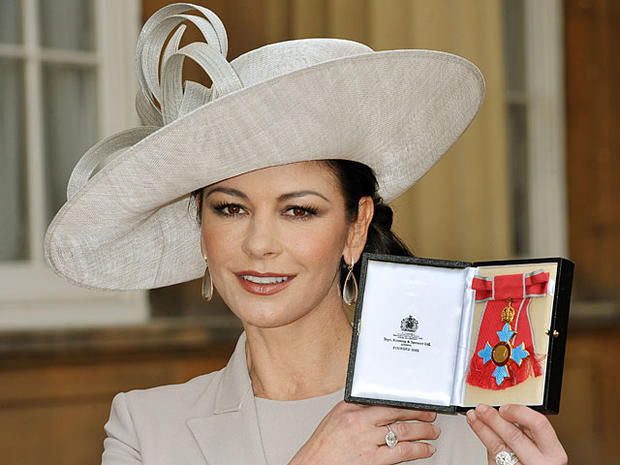Catherine Zeta-Jones holds herCommander of the Order of the British Empire (CBE) at Buckingham Palace in London, on Feb. 24, 2011.  (STILLWELL/AFP/Getty Images) 