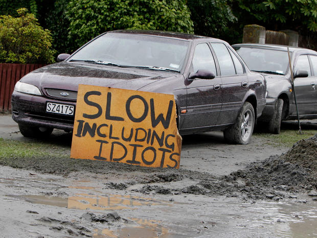 A sign asking for motorists to drive slowly  