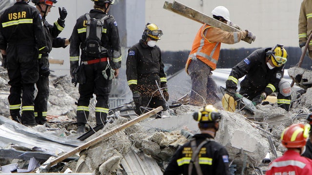 Recovery workers at an earthquake-damaged building in Christchurch, New Zealand 