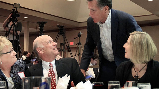 Former Massachusetts Gov. MItt Romney works the tables like a presidential candidate. 