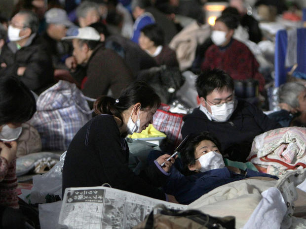 Survivors shelter at an evacuation center at Watari, Japan 