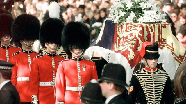 The coffin of Diana, Princess of Wales, laid on a gun carriage and flanked by the bearer of Welsh Guardsman, is lead to Westminster Abbey on Sept. 6, 1997.  