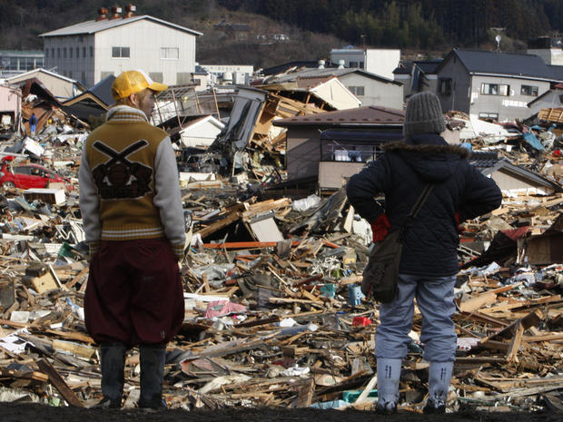 Residents survey tsunami damage in Miyagi Prefecture, Japan 