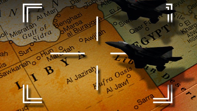Target sights and planes flying over a map of Libya 