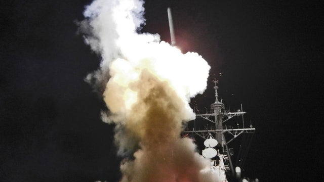  Arleigh Burke-class guided-missile destroyer USS Barry (DDG 52) launches a Tomahawk missile in support of Operation Odyssey Dawn 