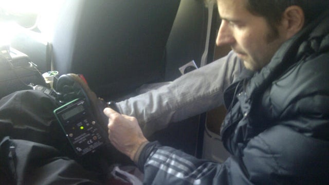 CBS cameraman Randy Schmidt checks radiation on his shoe 