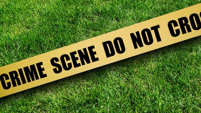 crimescene-tape-over-grass.jpg 