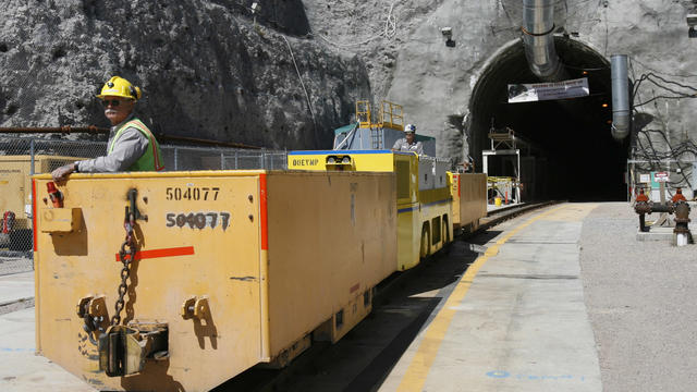 In this April 13, 2006 file photo, Pete Vavricka conducts an underground train from the entrance of Yucca Mountain in Nevada 