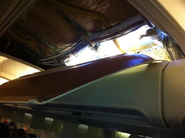 In this photo provided by passenger Christine Ziegler, shows an apparent hole in the cabin on a Southwest Airlines aircraft Friday, April 1, 2011 in Yuma, Ariz. Authorities say the flight from Phoenix to Sacramento, Calif., was diverted to Yuma due to rap 