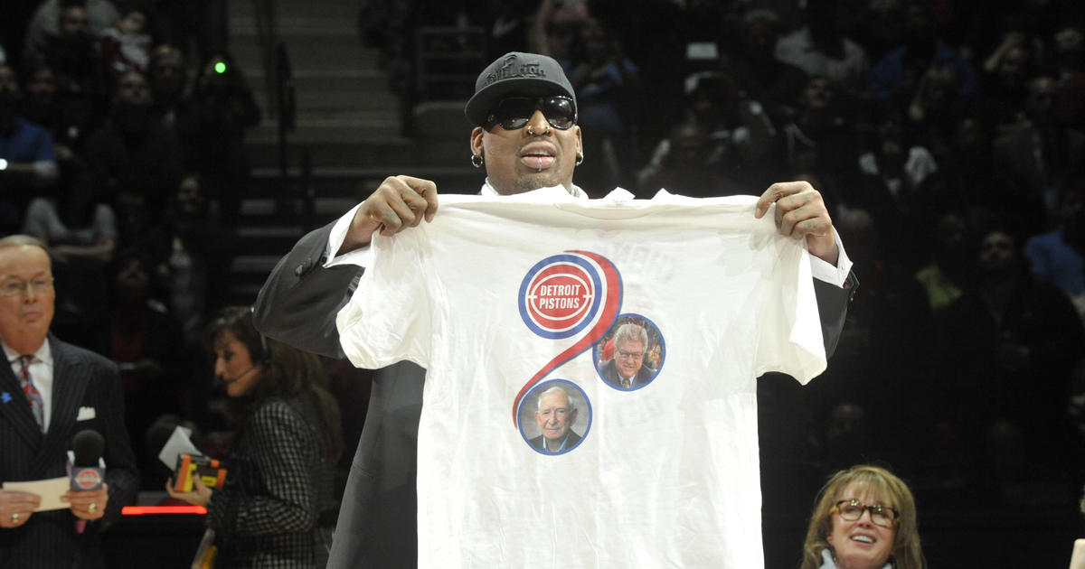 Dennis Rodman presents a t-shirt he created during the retirement