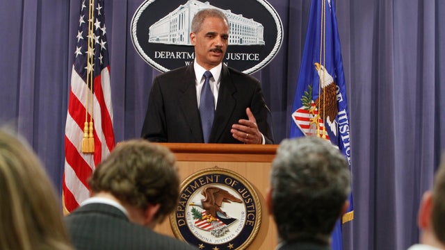 Attorney General Eric Holder gestures during a news conference at the Justice Department in Washington, Monday, April 4, 2011 