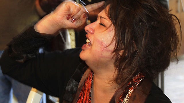 Iman Al-Obeidi is seen in Tripoli in this March 26, 2011 file photo, after storming into a hotel's breakfast room to show her wounds to foreign media.  