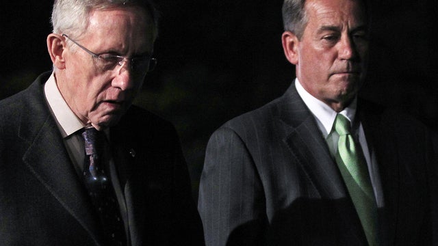 John Boehner, R-Ohio, and Harry Reid, D-Nev., leave the White House 