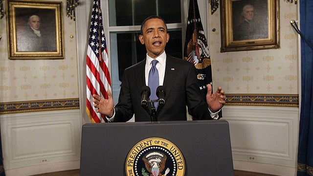 In this April 8, 2011 photo, President Obama poses for photographers in the Blue Room at the White House in Washington after he spoke regarding the budget and averted government shutdown after a deal was made between Republican and Democrat lawmakers.  