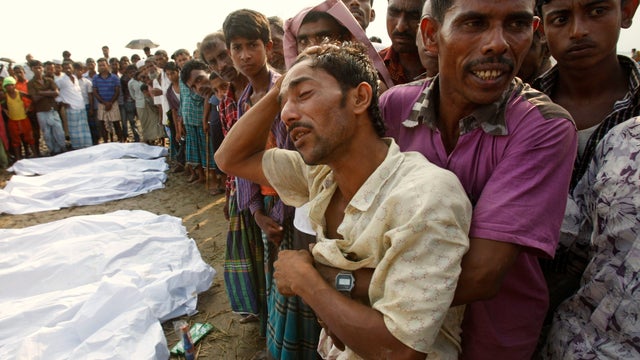 Bangladeshi Din Islam, center, weeps over loss of his children and wife in a ferry accident in the River Meghna in Brahmanbaria district about 50 miles east of Dhaka, Bangladesh, April 21, 2011.  