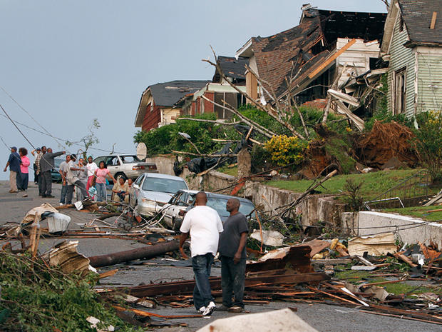 Residents survey the destruction after a tornado 