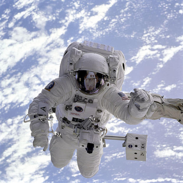 Held securely by the Shuttle Endeavour's robot arm during a spacewalk on the STS-69 mission in 1995, astronaut Michael Gernhardt was for the first time able to use a new piece of technology, an electronic cuff checklist, a prototype developed for the asse 