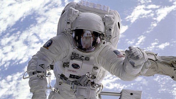 Held securely by the Shuttle Endeavour's robot arm during a spacewalk on the STS-69 mission in 1995, astronaut Michael Gernhardt was for the first time able to use a new piece of technology, an electronic cuff checklist, a prototype developed for the asse 
