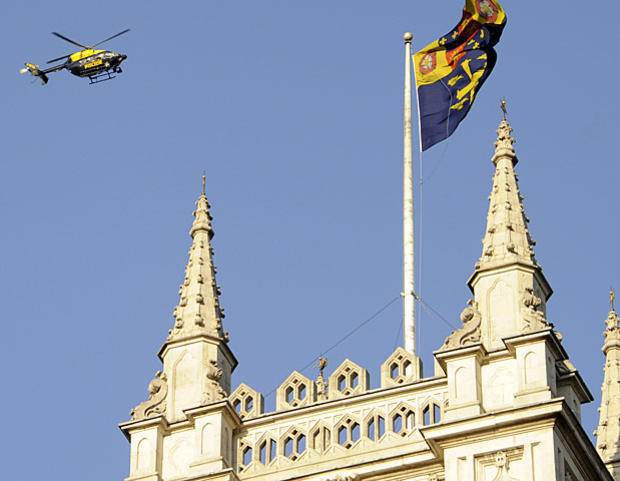 A police helicopter hovers above London's Westminster Abbey on April 27, 2011. 