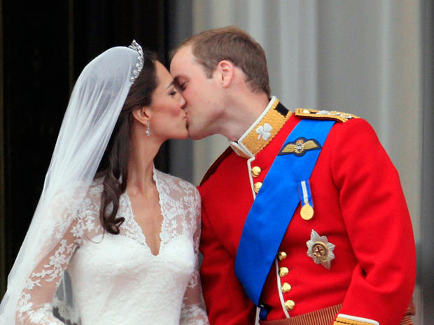 Britain's Prince William kisses his wife Kate, Duchess of Cambridge on the balcony of Buckingham Palace 