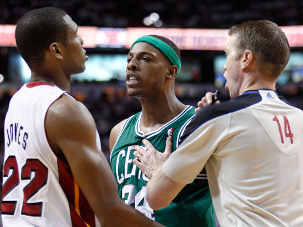 Boston Celtics' Paul Pierce is held back by referee Ed Malloy 