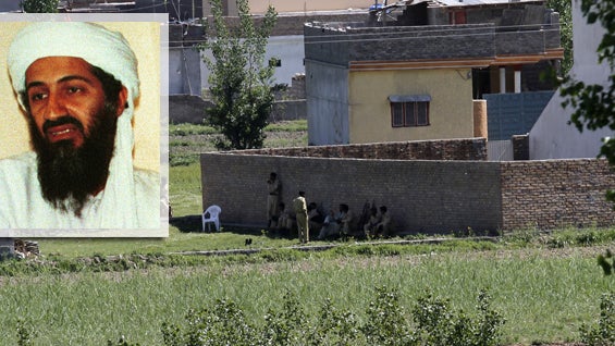 Pakistan army soldiers rest near the house where it is believed al-Qaida leader Osama bin Laden 