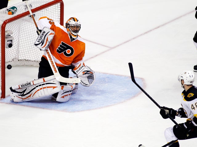 David Krejci looks at his game-winning goal in the net 