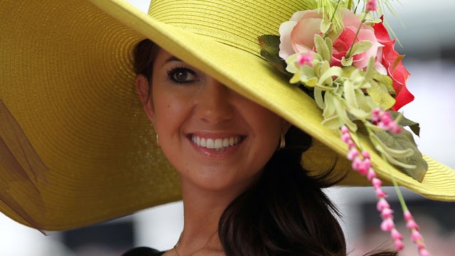 A fan looks on wearing her derby hat during the 137th Kentucky Derby at Churchill Downs on May 7, 2011, in Louisville, Ky.  