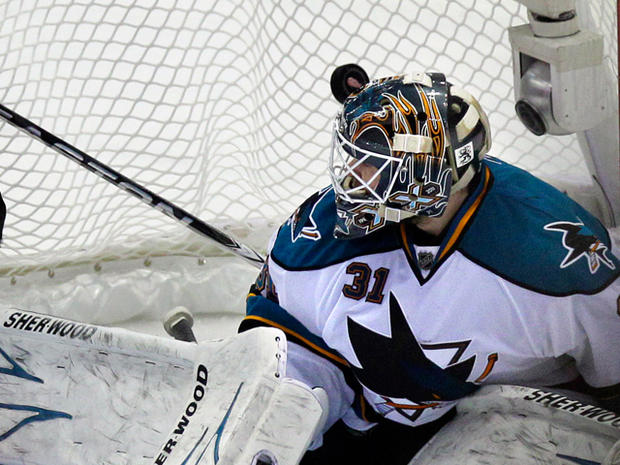 Sharks goalie Antti Niemi looks back as the shot goes into the net  