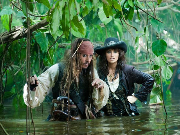 Captain Jack and Angelica make their watery way through the jungle  